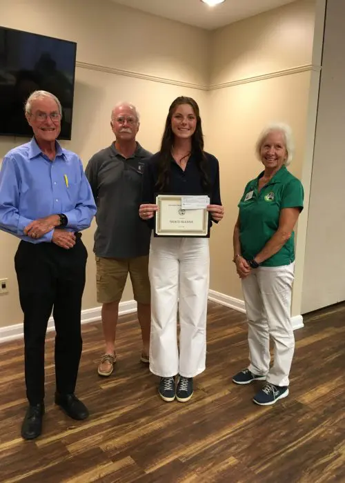 Grace Glennie receives her AMGA scholarship from the Scholarship Committee