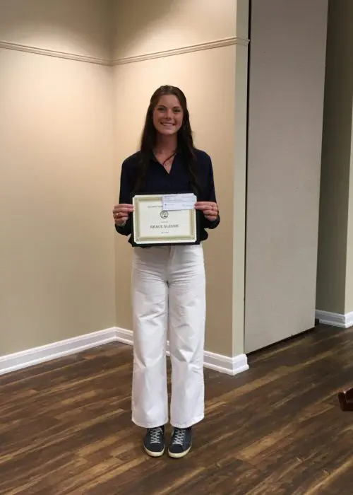 Grace Glennie displays her AMGA scholarship